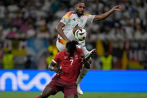 Jonathan Tah challenges Breel Embolo